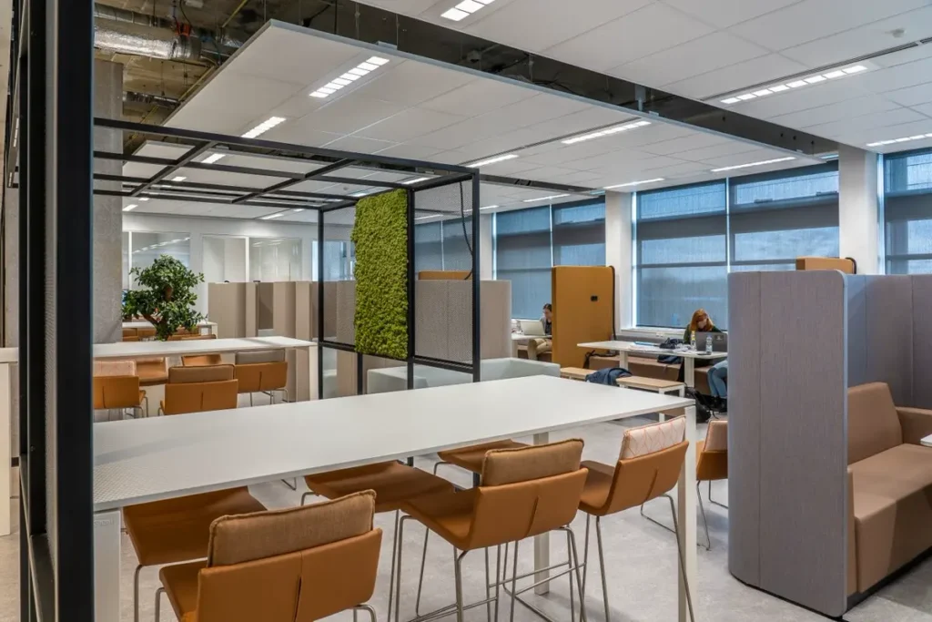 co-working space fit-out with workstations and acoustic booths sourced from china