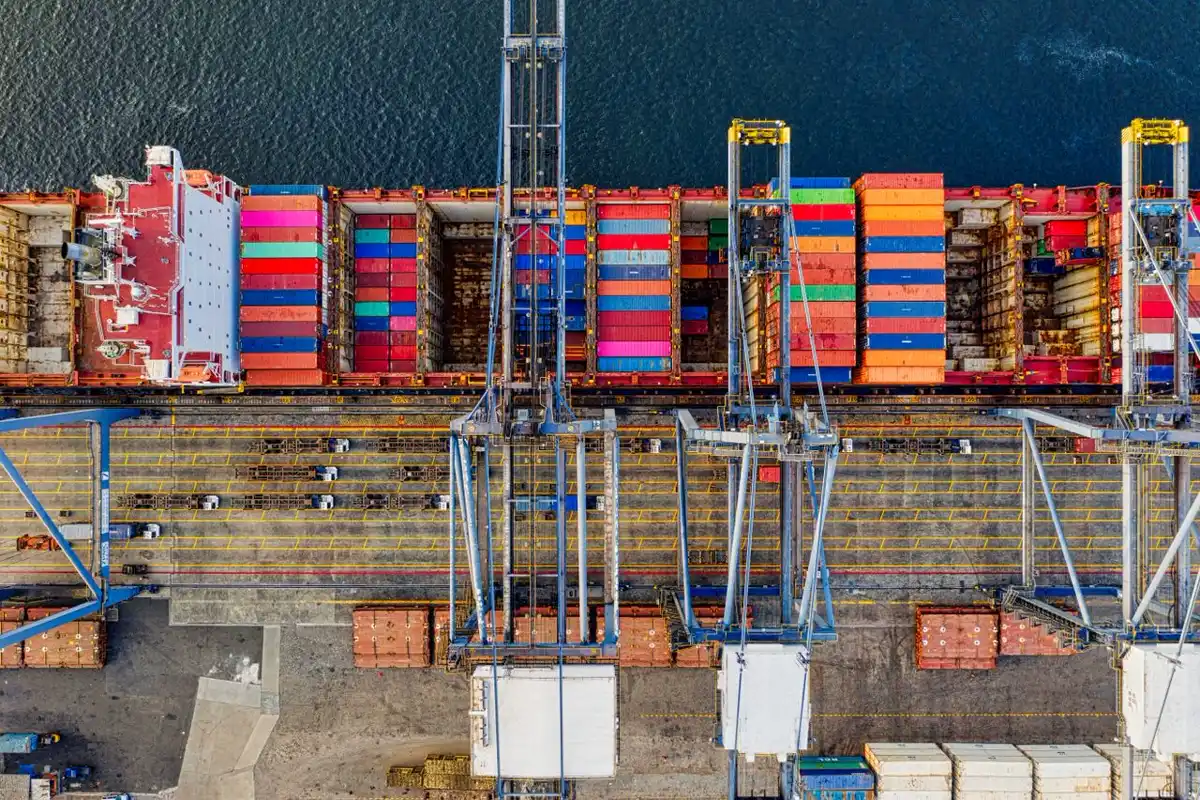 Container terminal handling a project import from China, illustrating who clears customs