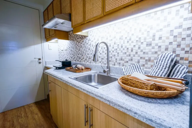 Extended-stay hotel FF&E procurement — guest room kitchenette with cabinets and sink