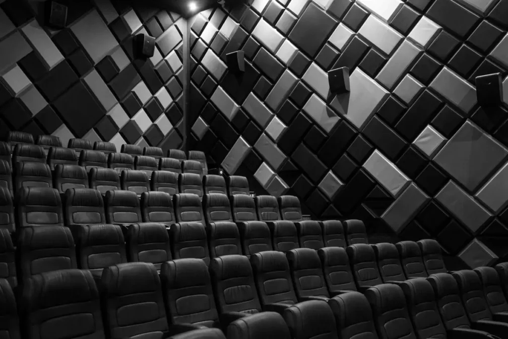 Fabric acoustic wall panels installed in a commercial cinema auditorium for sound absorption