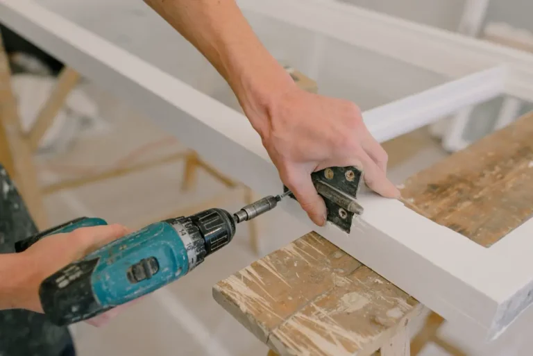 installer assembling ff&e on site using installation drawings and assembly documents
