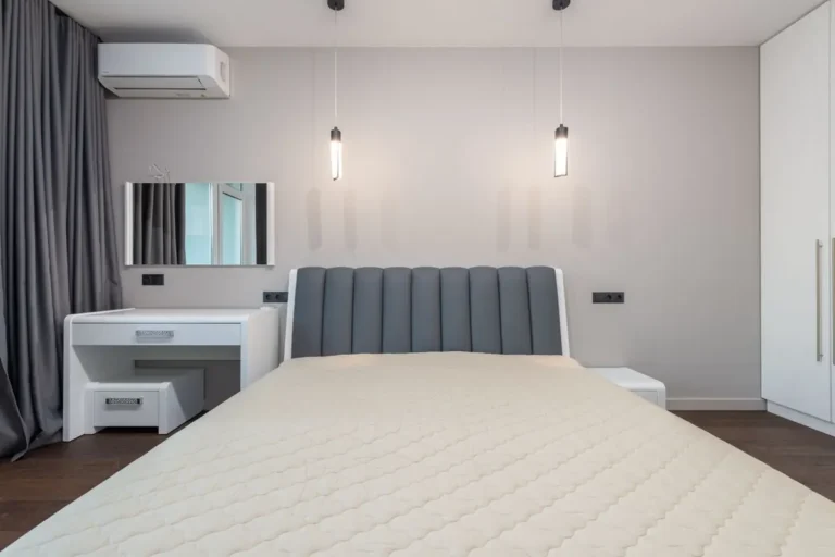 Hotel guest room with built-in wardrobe and loose bed — fixed vs loose FF&E scope on hotel projects