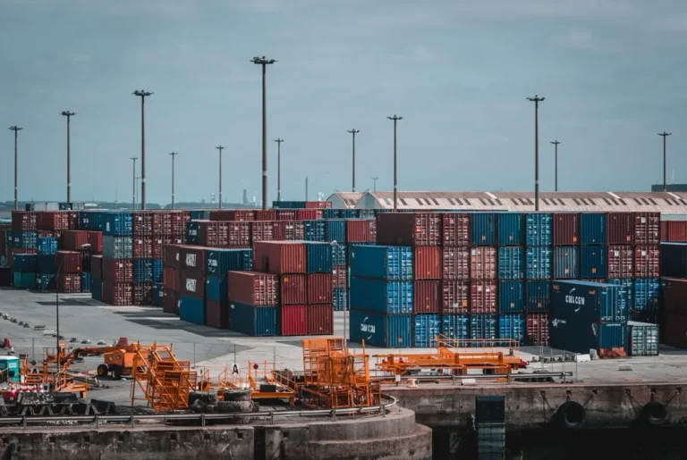 Container yard with handling equipment, illustrating HS codes for furniture and building materials imported from China