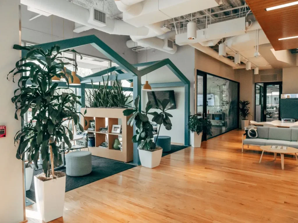 Green office interior with plants and wood flooring - LEED and WELL documentation from Chinese factories