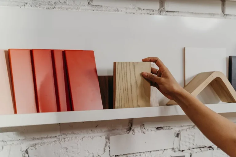 Comparing wood veneer finish samples to match existing finishes on a Phase 2 FF&E order from China