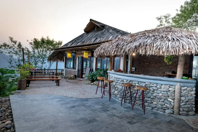 Porcelain pavers vs natural stone: paved outdoor commercial terrace with stone bar and seating