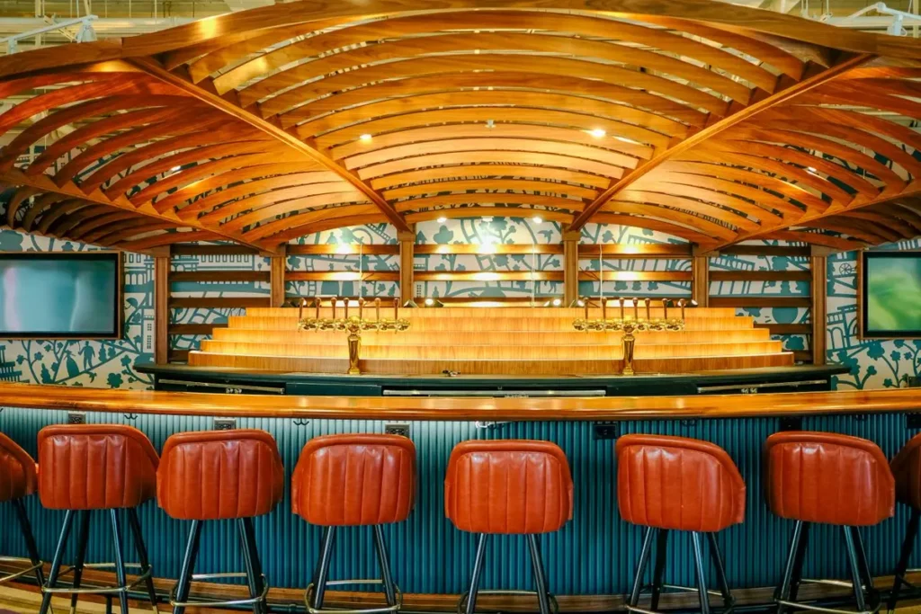 Commercial bar counter with joinery and stools sourced from China for pub chain projects