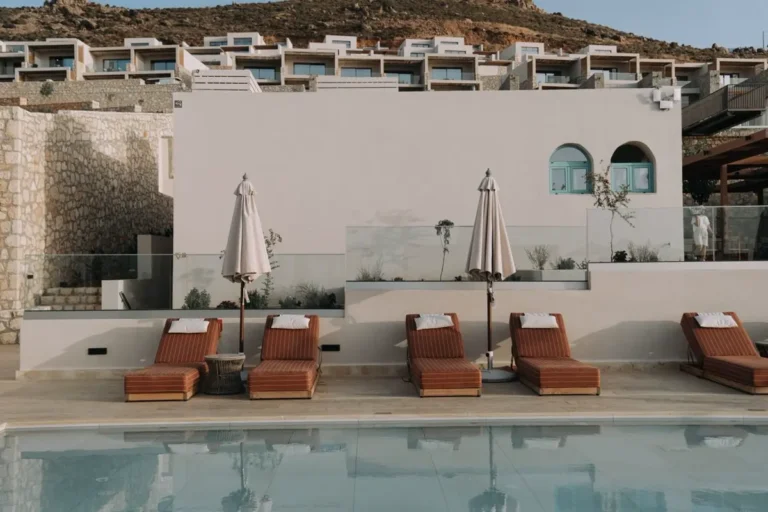 Resort pool deck with sun loungers and umbrellas - outdoor furniture manufacturers in China for hotel projects