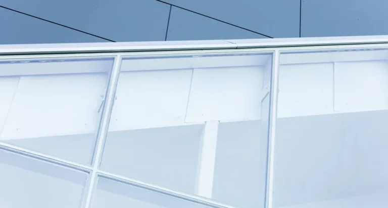 Commercial building window glazing for motorized roller blind and shading systems