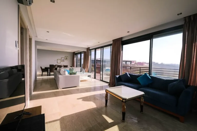 Serviced apartment living and dining area furnished through a China FF&E procurement package