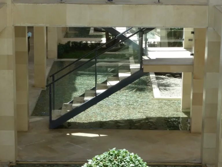 Glass balustrade railing with steel frame on a staircase in a commercial building