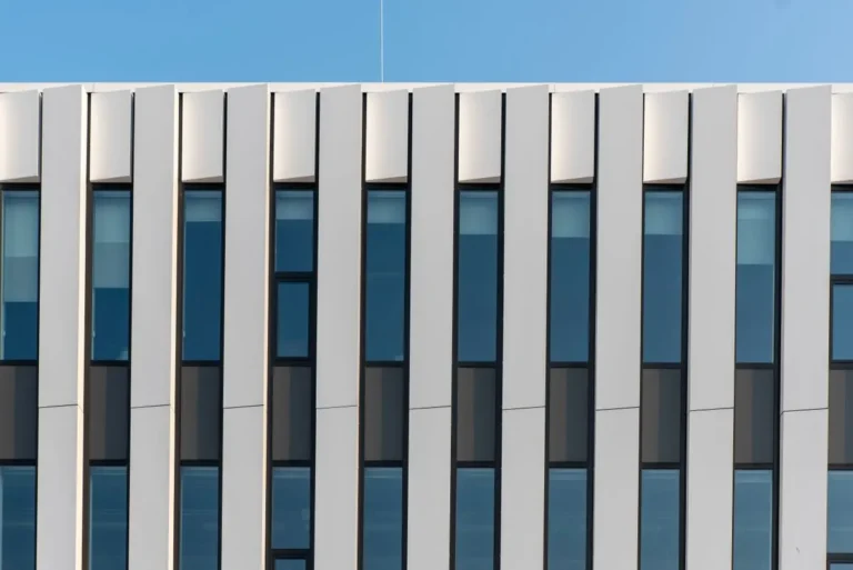 Aluminium window and door facade on a commercial building, illustrating aluminium window manufacturers in China for US projects