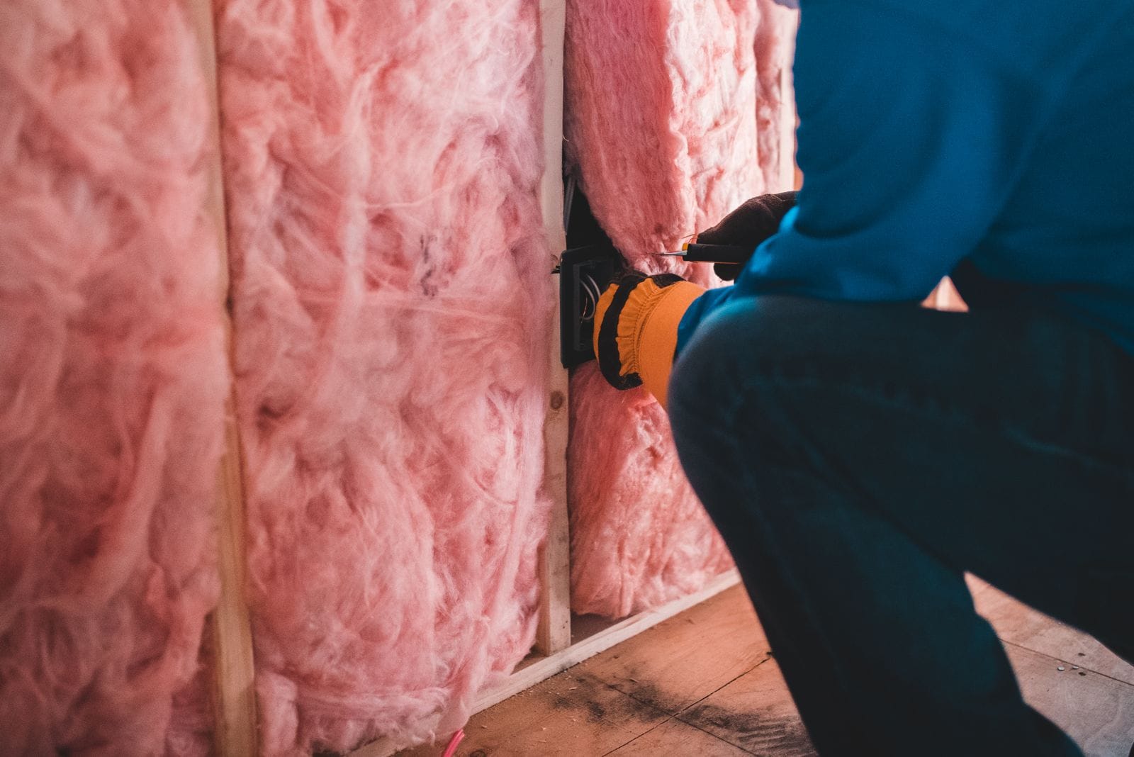 Mineral wool insulation being installed on a commercial building site