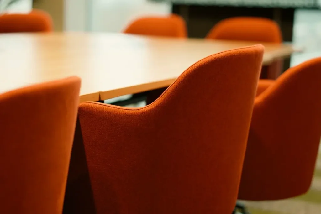 Upholstered meeting chairs around a conference table - commercial furniture manufacturers in China for Australian projects