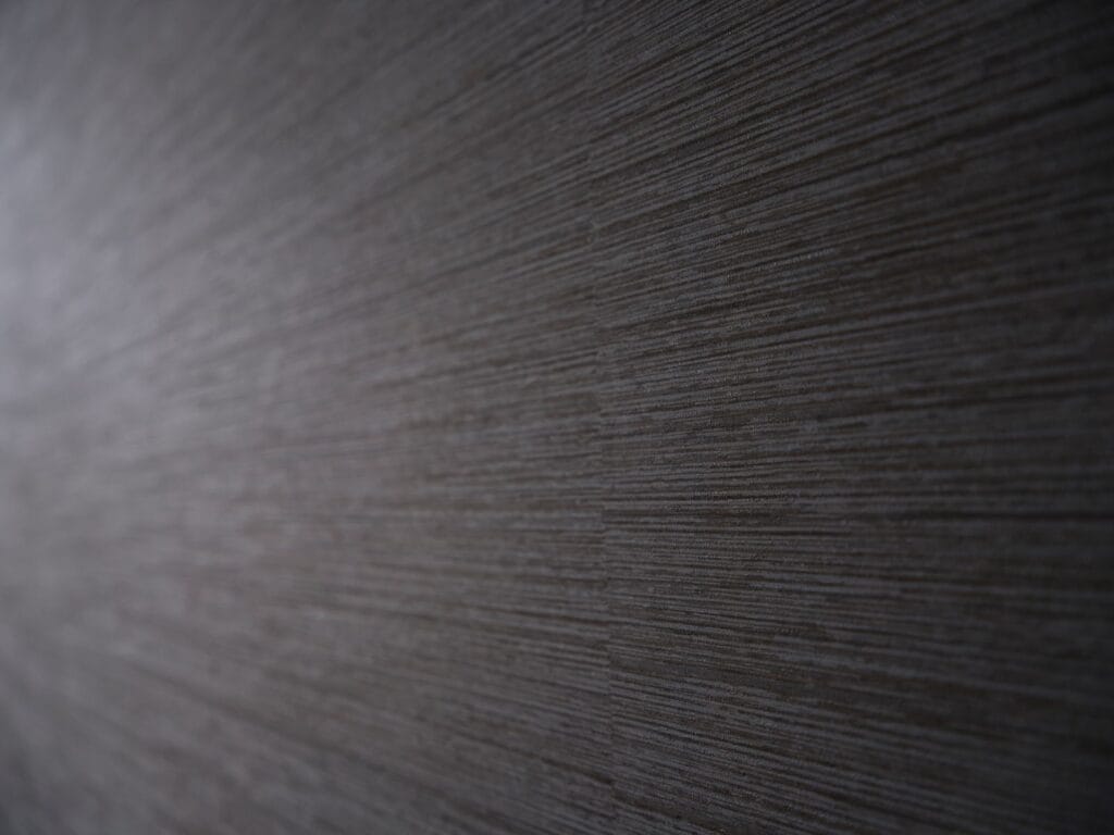 Close-up of textured commercial wallcovering with horizontal linear weave