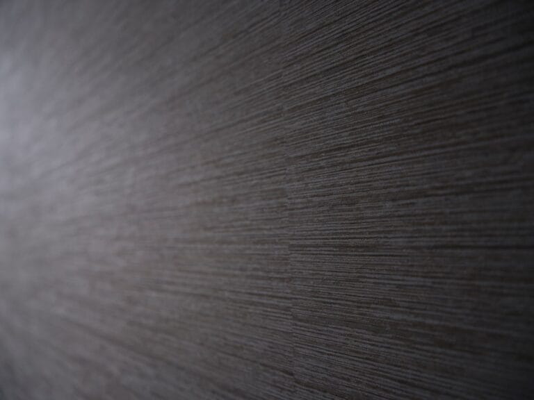 Close-up of textured commercial wallcovering with horizontal linear weave