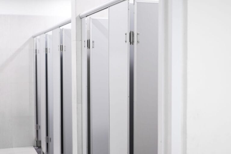 Laminate toilet partitions in a commercial washroom