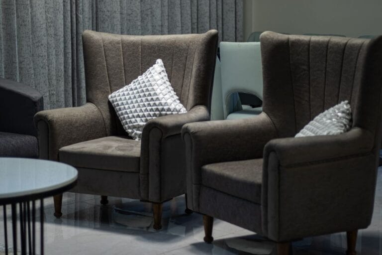 Upholstered lounge armchairs in a hotel public area