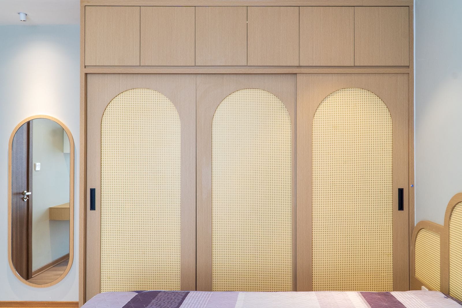 Wooden wardrobe and casegoods in a hotel guestroom