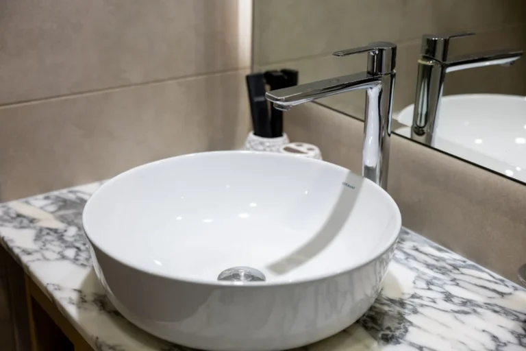 Hotel washroom counter with basins and mixers, the fixtures a hotel sanitaryware brief has to specify before a China quote