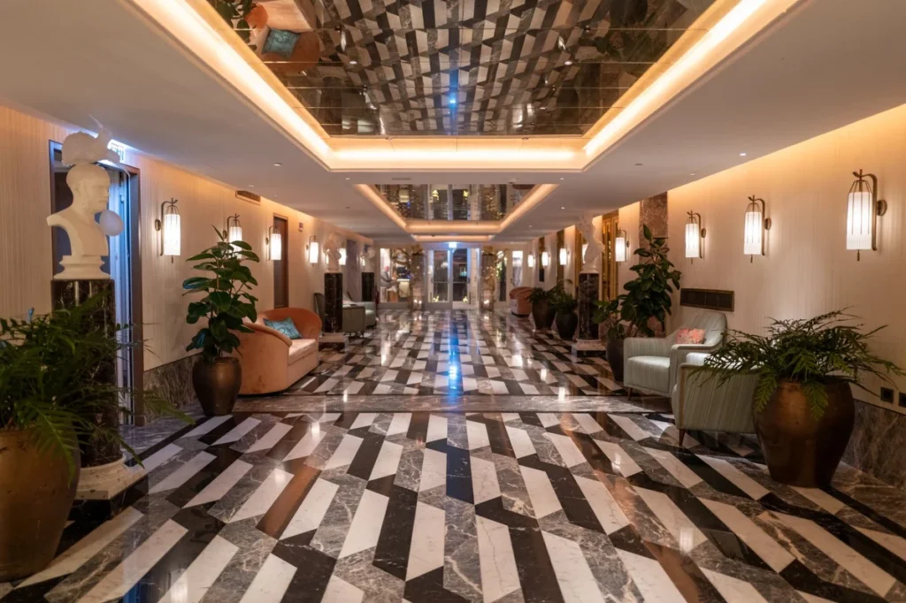 Tile manufacturer in China: large-format porcelain tile floor in a hospitality project corridor