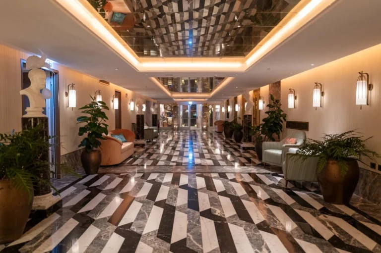 Tile manufacturer in China: large-format porcelain tile floor in a hospitality project corridor