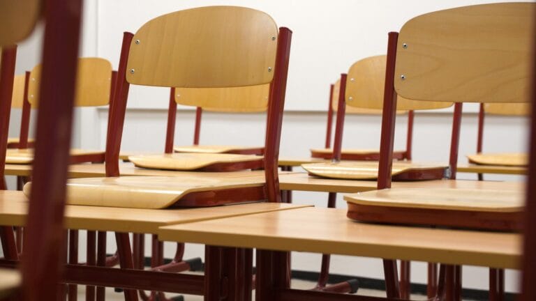 School classroom desks and chairs in an empty teaching space