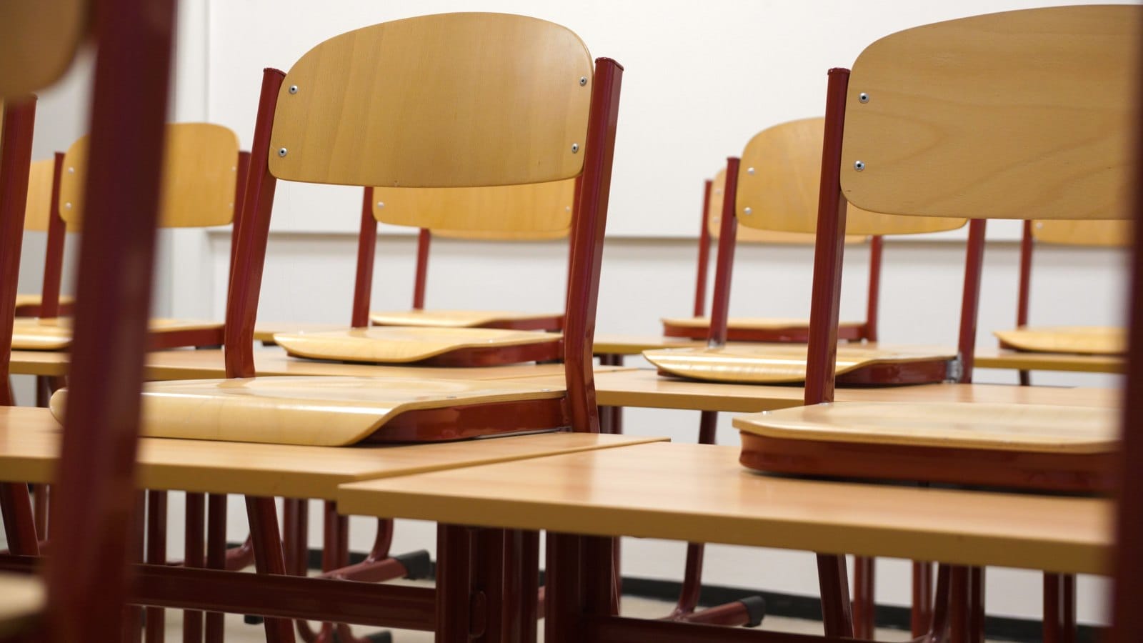 School classroom desks and chairs in an empty teaching space