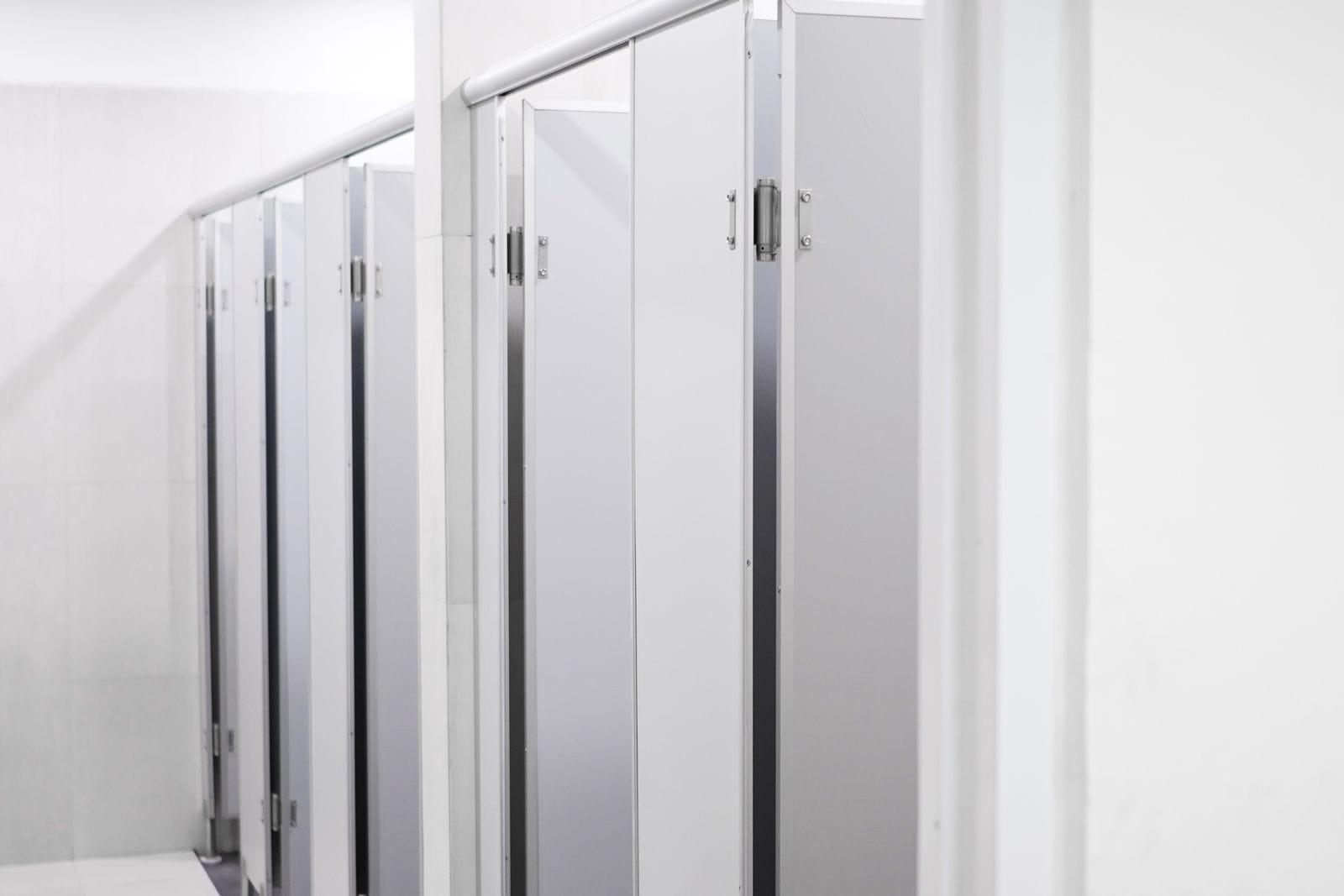 Laminate toilet partitions in a commercial washroom