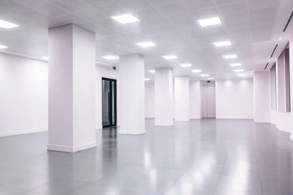 Large-format porcelain floor tiles in an empty commercial space, representing tile specification for Australian commercial projects