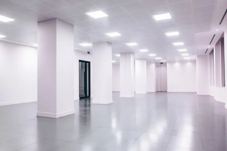 Large-format porcelain floor tiles in an empty commercial space, representing tile specification for Australian commercial projects