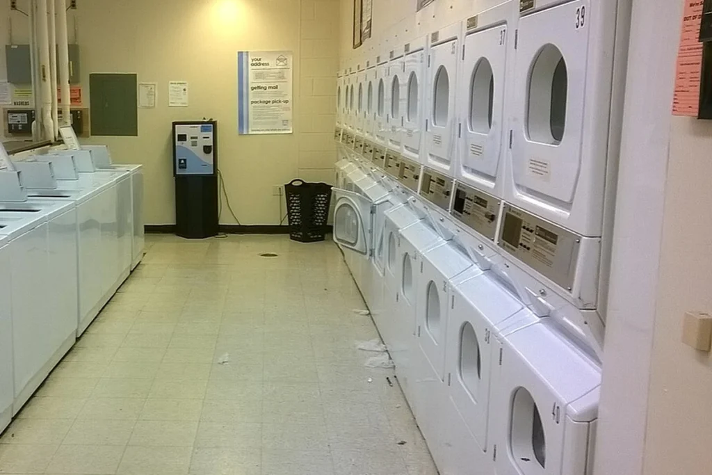 Rows of washers and tumble dryers in an on-premise laundry, commercial laundry equipment manufacturers in China