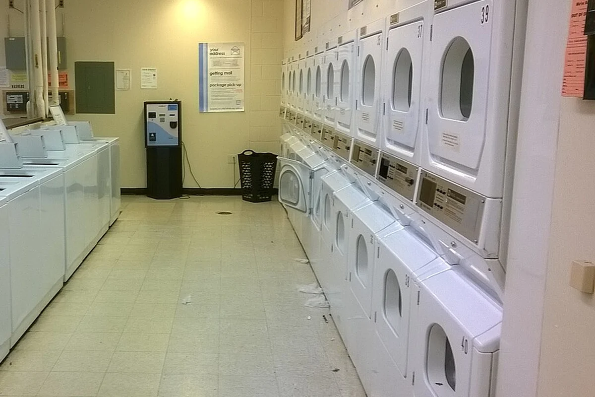 Rows of washers and tumble dryers in an on-premise laundry, commercial laundry equipment manufacturers in China