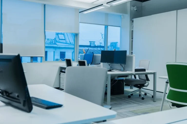 Open-plan office with bench desks, task chairs and storage pedestals