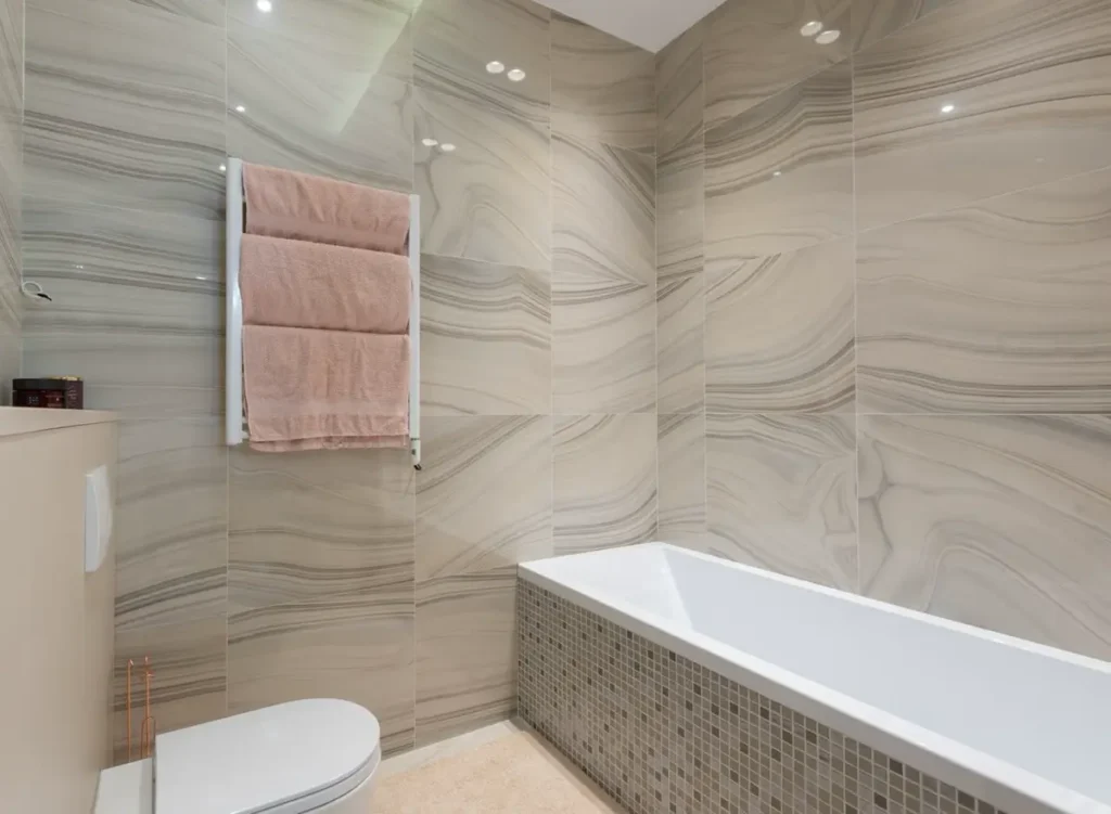 Tiled bathroom interior representing prefab bathroom pods for UK PBSA and hotel projects