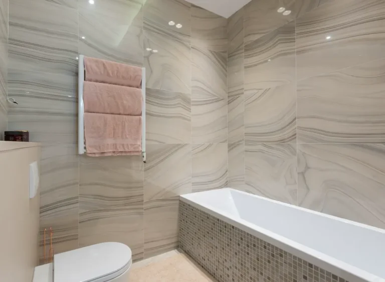 Tiled bathroom interior representing prefab bathroom pods for UK PBSA and hotel projects