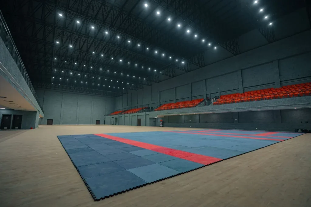 Indoor sports hall with hardwood court flooring and interlocking sports floor tiles