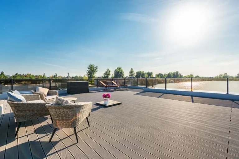Rooftop terrace with grey composite decking boards and outdoor lounge furniture