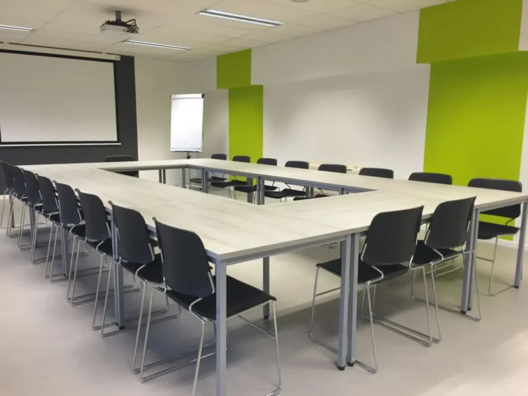EN 15372:2023 non-domestic tables in a commercial meeting room with a conference table.