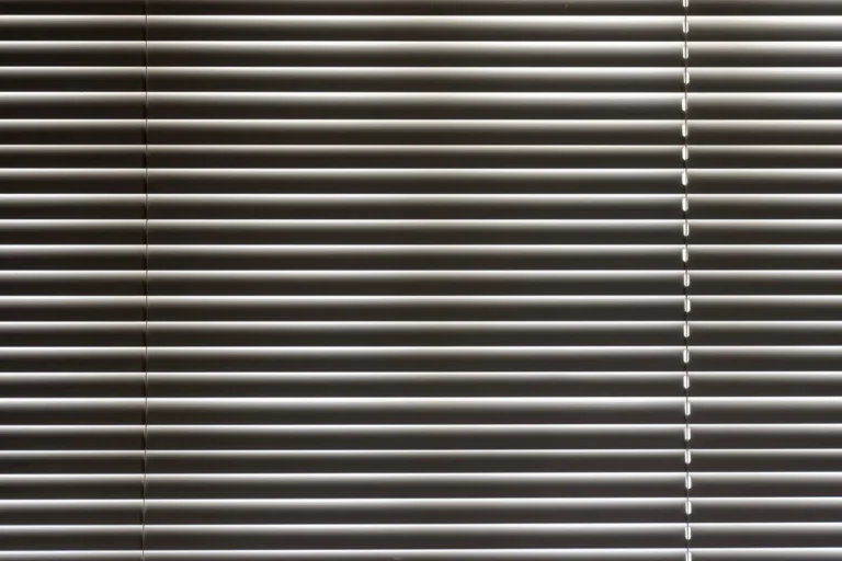Close-up of horizontal metal window blinds