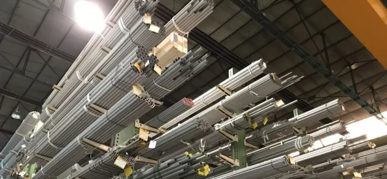Metal tubes stacked on warehouse racks