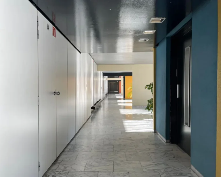 Raised access floor planning for office buildings, shown in a contemporary office corridor.