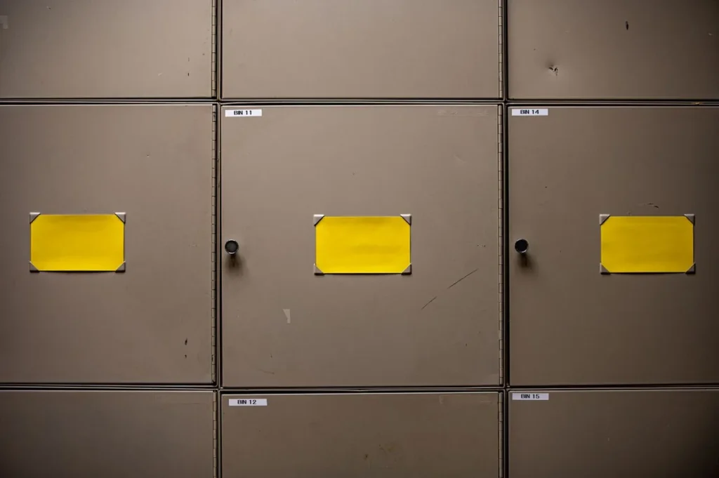 Steel storage cabinet doors with number labels and cylinder locks