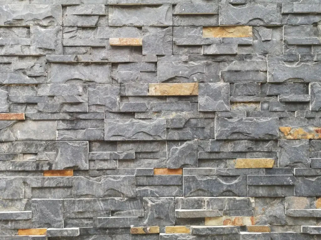 Grey stone ledge veneer wall cladding with layered rectangular stone pieces