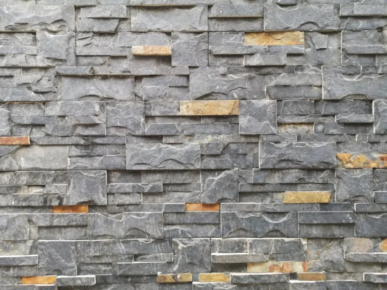 Grey stone ledge veneer wall cladding with layered rectangular stone pieces