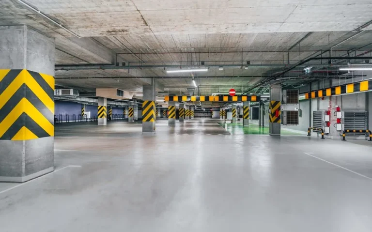 Underground car park with yellow and black column guards