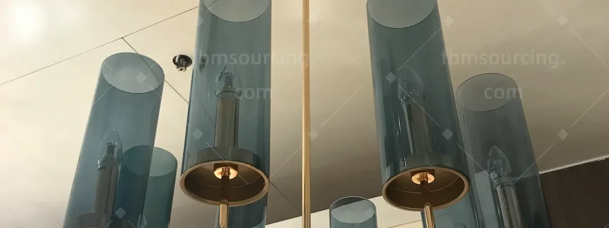 Blue glass and brass candle chandelier selected at lighting market