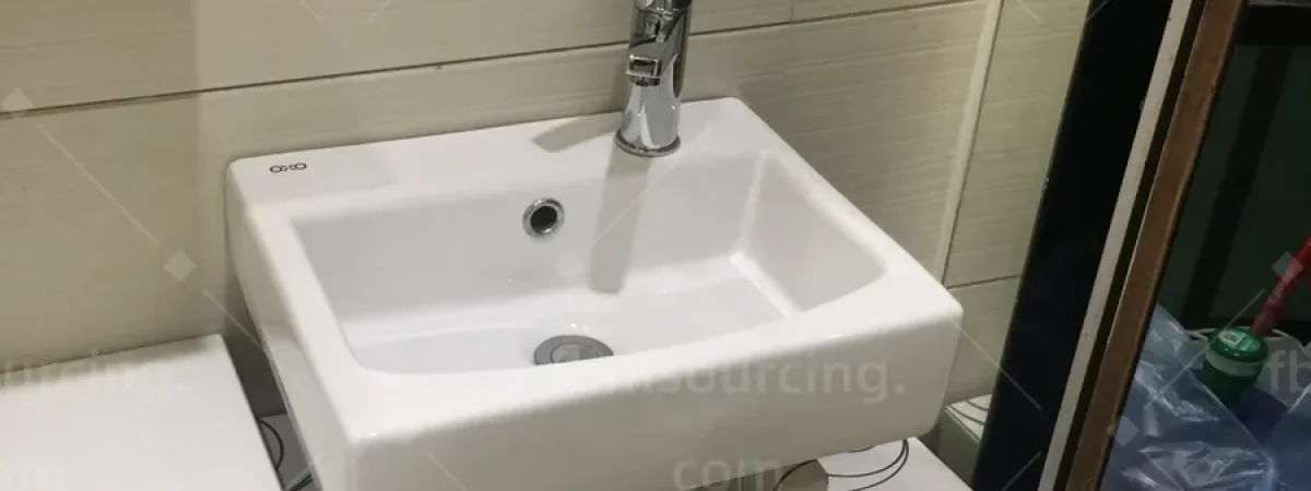 Wall-hung ceramic basin selection in Foshan sanitary ware showroom for villa bathrooms
